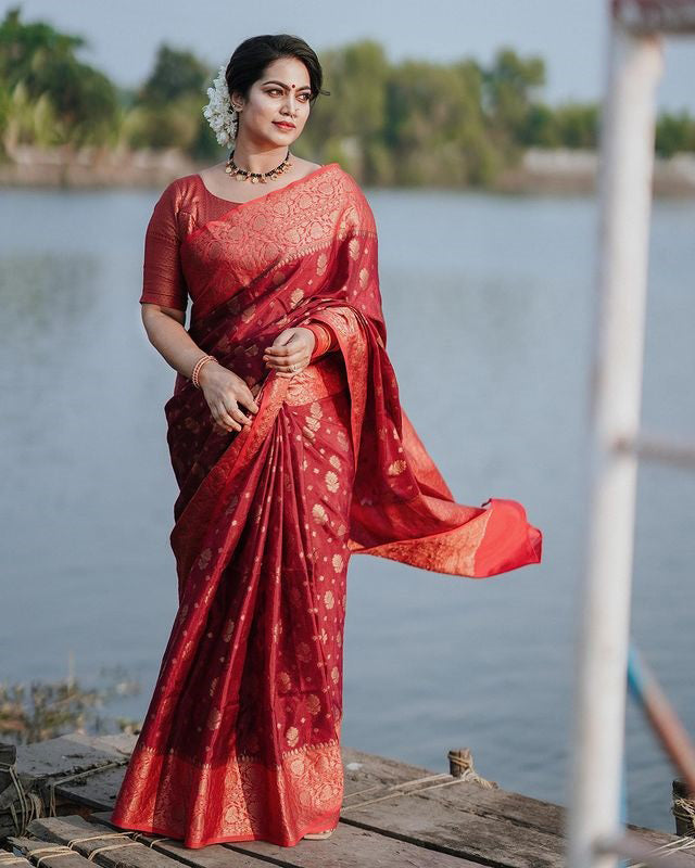 Mellifluous Red Soft Silk Saree With Elision Blouse Piece