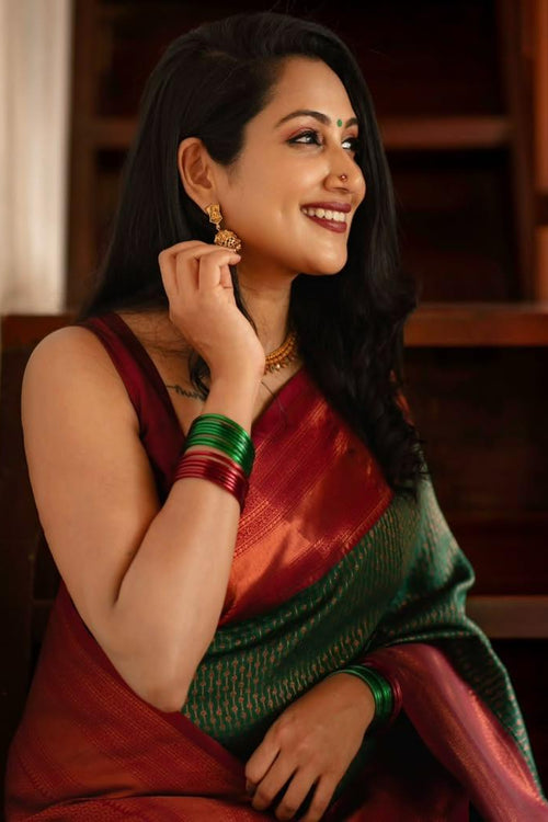 Load image into Gallery viewer, Extraordinary Dark Green Soft Silk Saree With Adorning Blouse Piece
