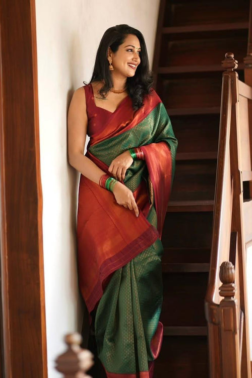 Load image into Gallery viewer, Extraordinary Dark Green Soft Silk Saree With Adorning Blouse Piece
