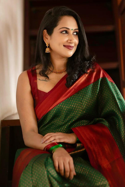 Load image into Gallery viewer, Extraordinary Dark Green Soft Silk Saree With Adorning Blouse Piece
