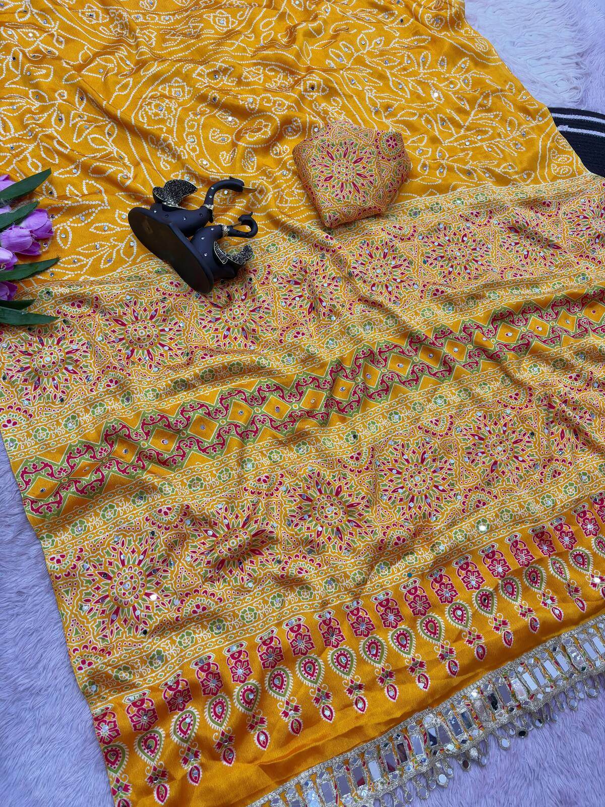 Enticing Yellow Ajrakh Printed Mirror Work Satin Silk Saree With Surreptitious Blouse Piece