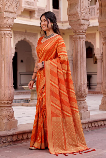 Comely Orange Banarasi Khadi Silk Saree With Jubilant Blouse Piece