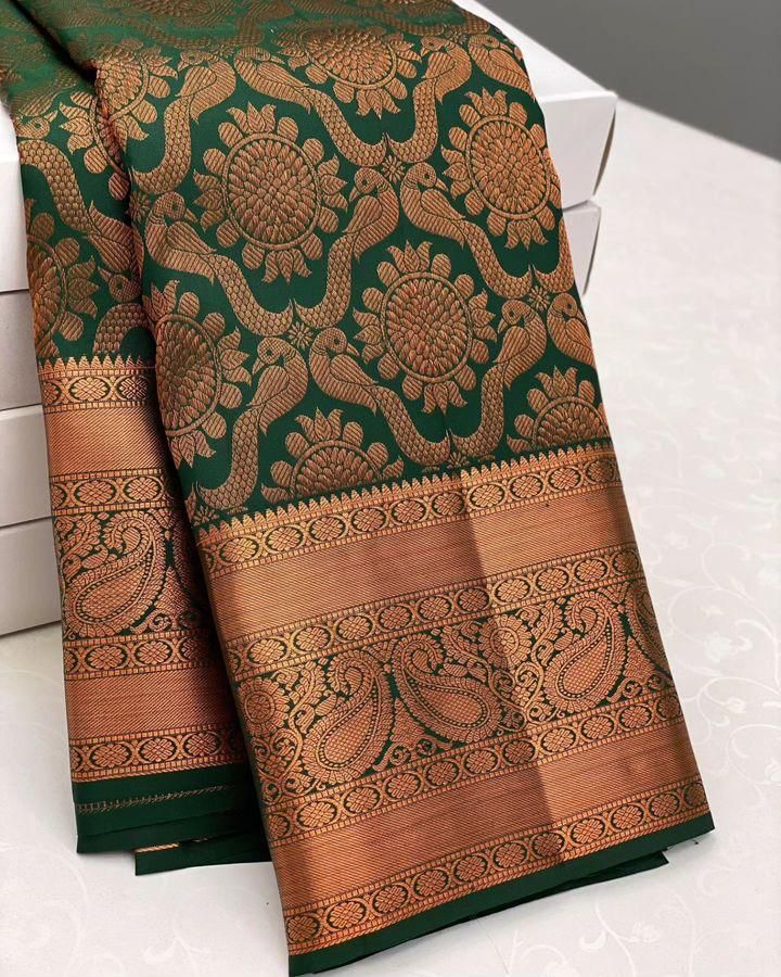 Intricate Dark Green Soft Silk Saree With Glorious Blouse Piece