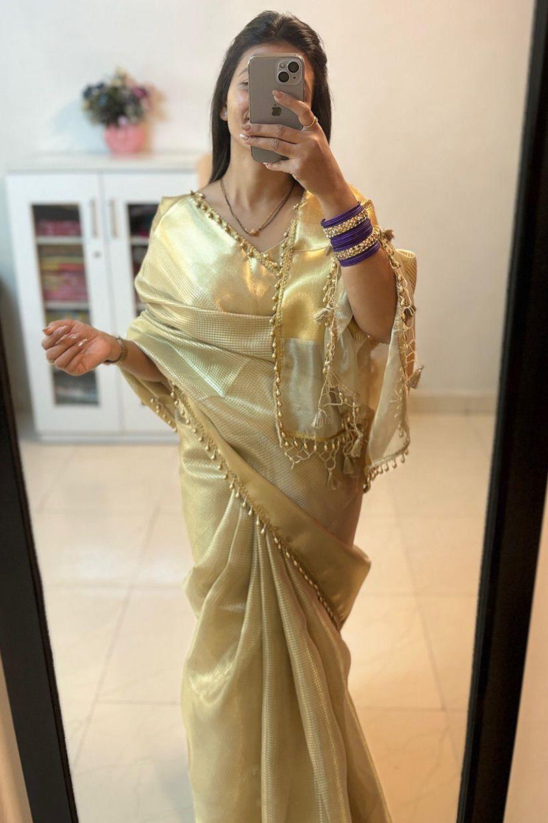 Fancifull Golden Soft Tissue Silk Saree With Demesne Blouse Piece