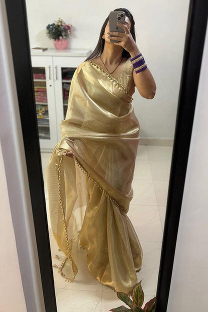 Fancifull Golden Soft Tissue Silk Saree With Demesne Blouse Piece