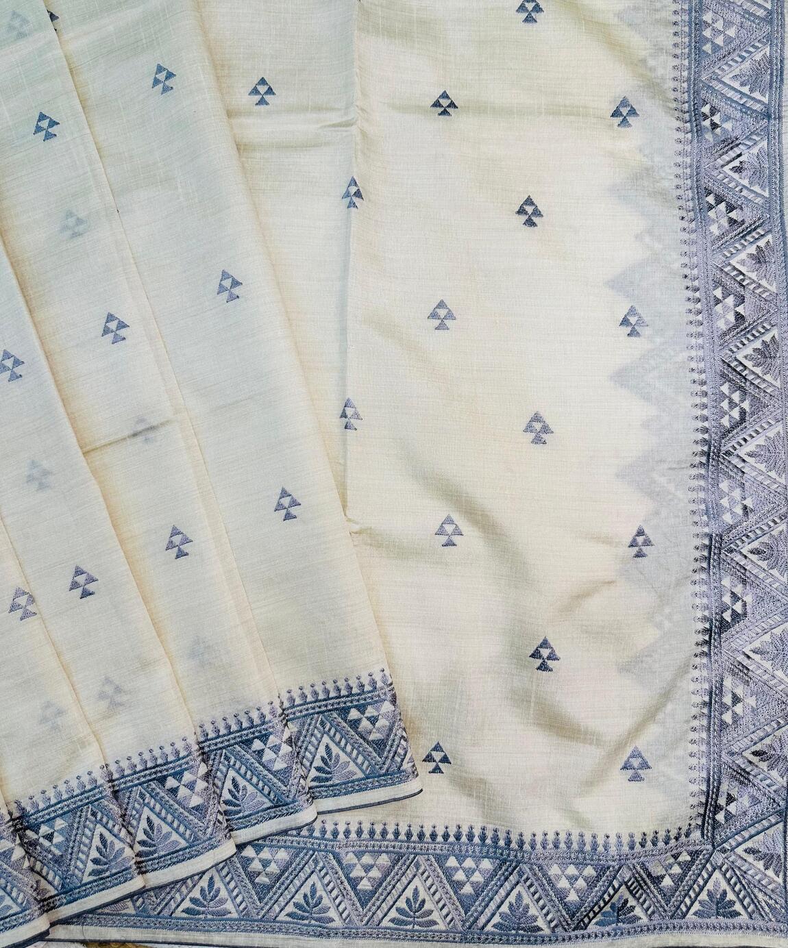 Cynosure Off White Embroidery Work Tussar Silk Saree With Smart Blouse Piece