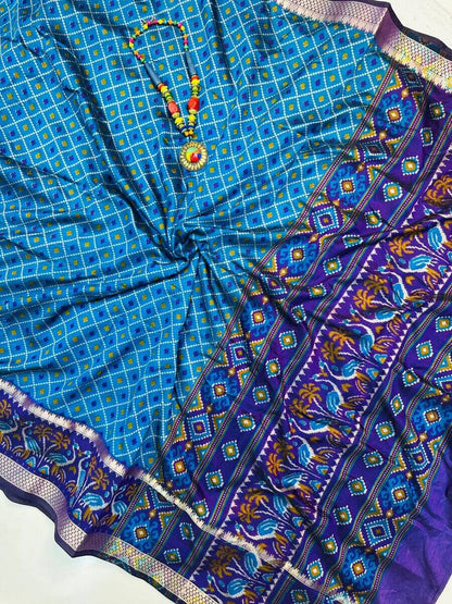 Dalliance Firozi Soft Printed Patola Silk Saree with Tantalizing Blouse Piece