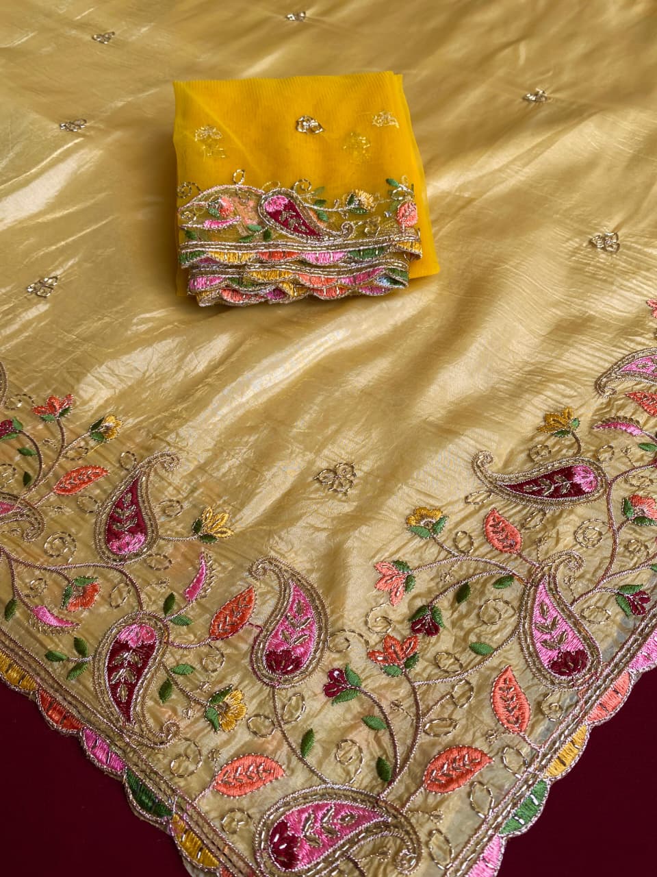 Cynosure Yellow Embroidery Work Crush Silk Saree With Desultory Blouse Piece