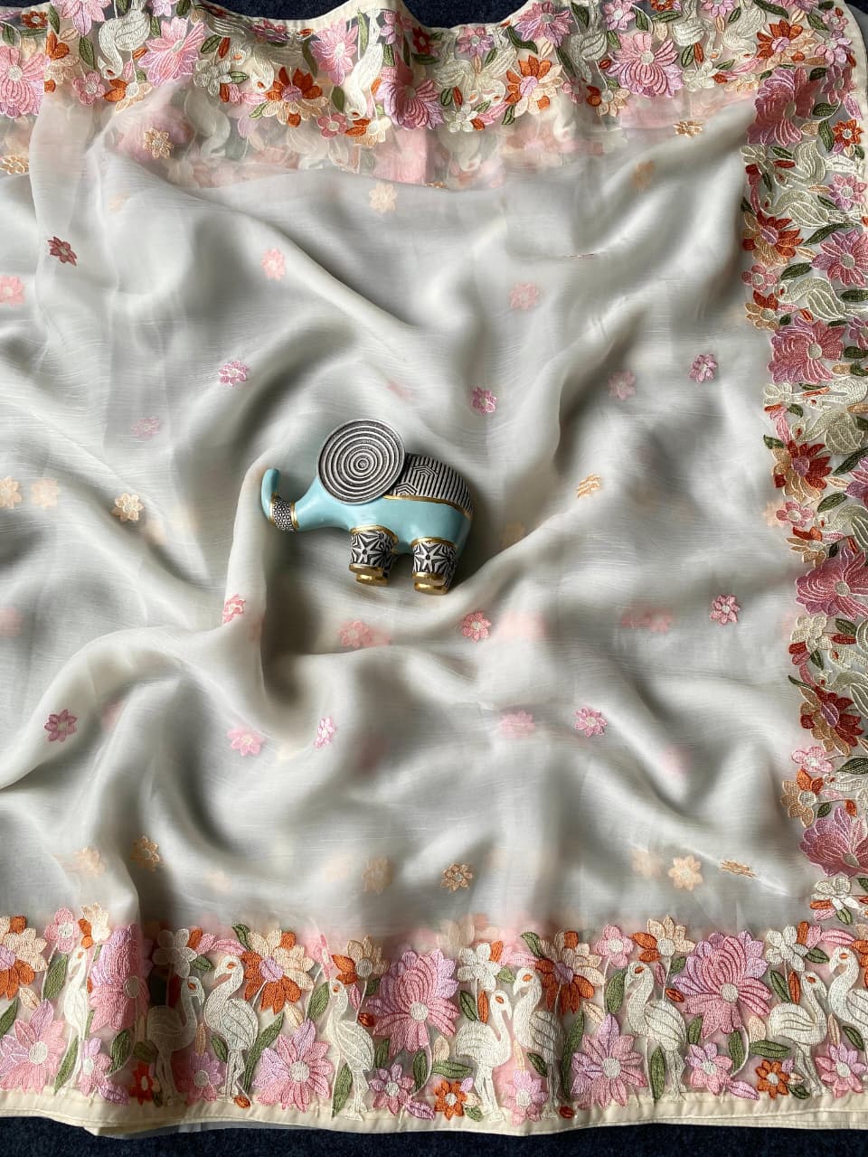 Surpassing Off White Embroidery Work Chiffon Silk Saree With Staring Blouse Piece