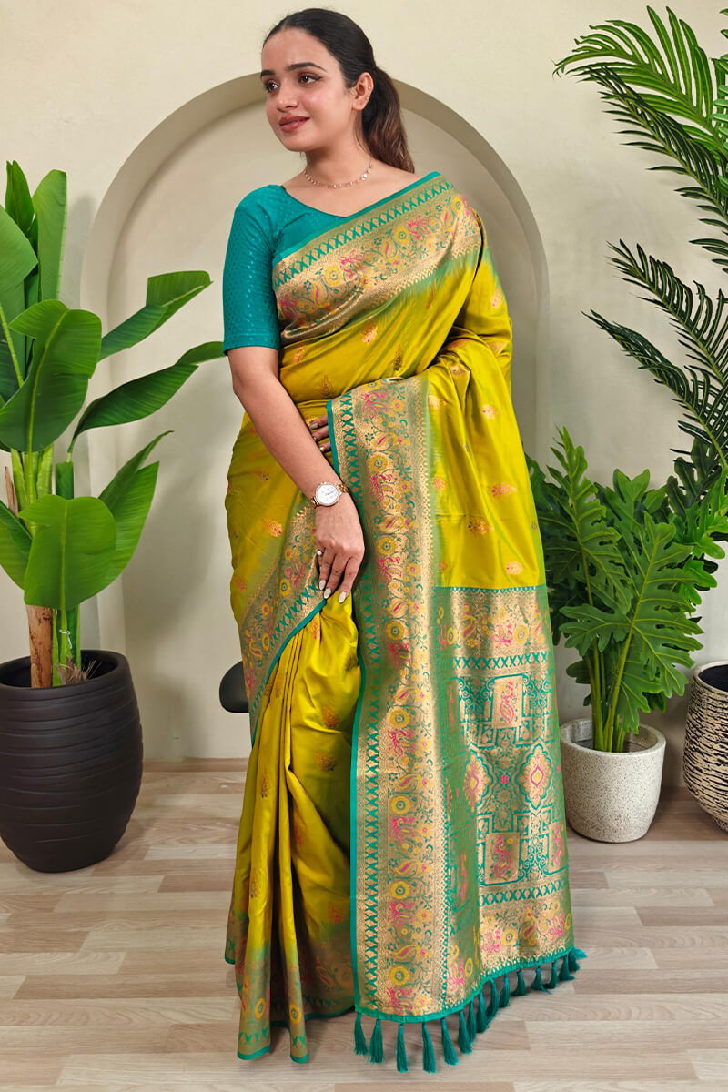 Cynosure Mehndi Soft Banarasi Silk Saree With Glowing Blouse Piece