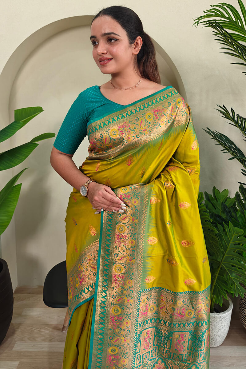 Cynosure Mehndi Soft Banarasi Silk Saree With Glowing Blouse Piece