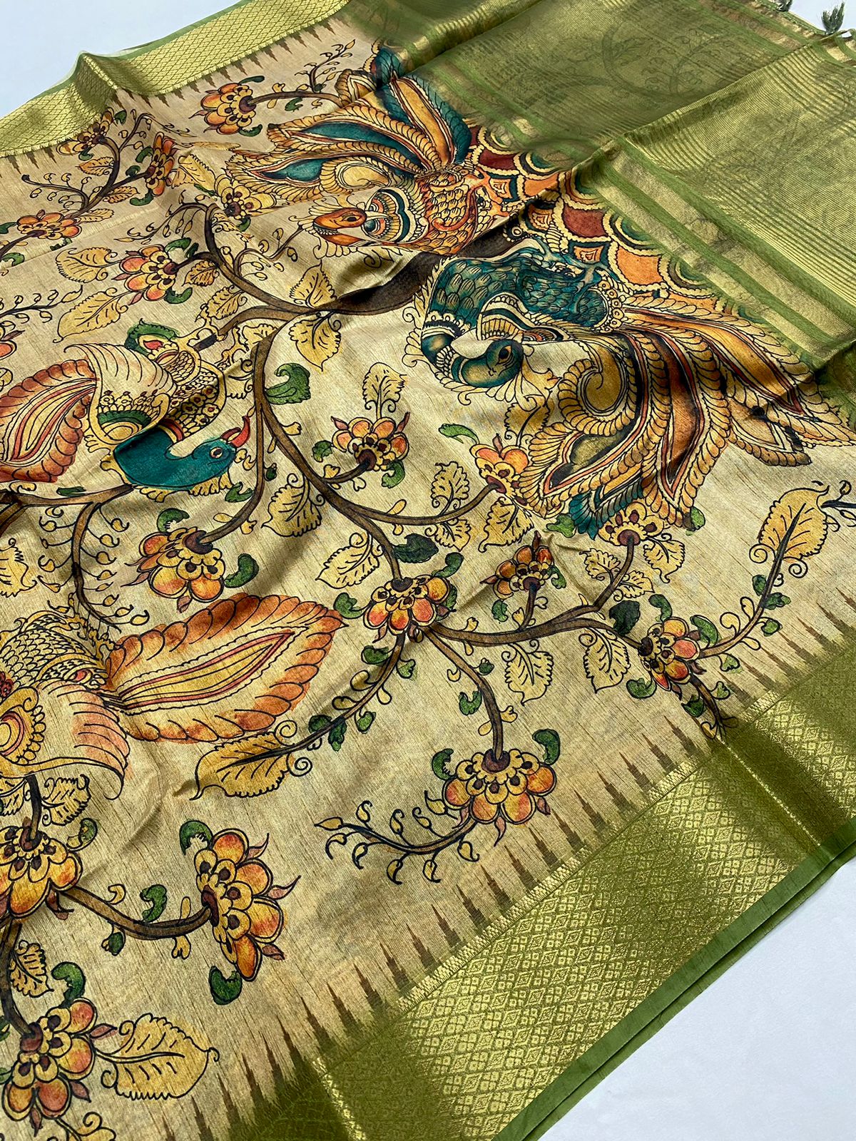 Precious Green Kalamkari Printed Saree With Innovative Blouse Piece