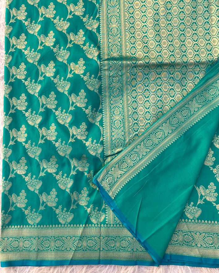 Girlish Rama Soft Banarasi Silk Saree With Blooming Blouse Piece