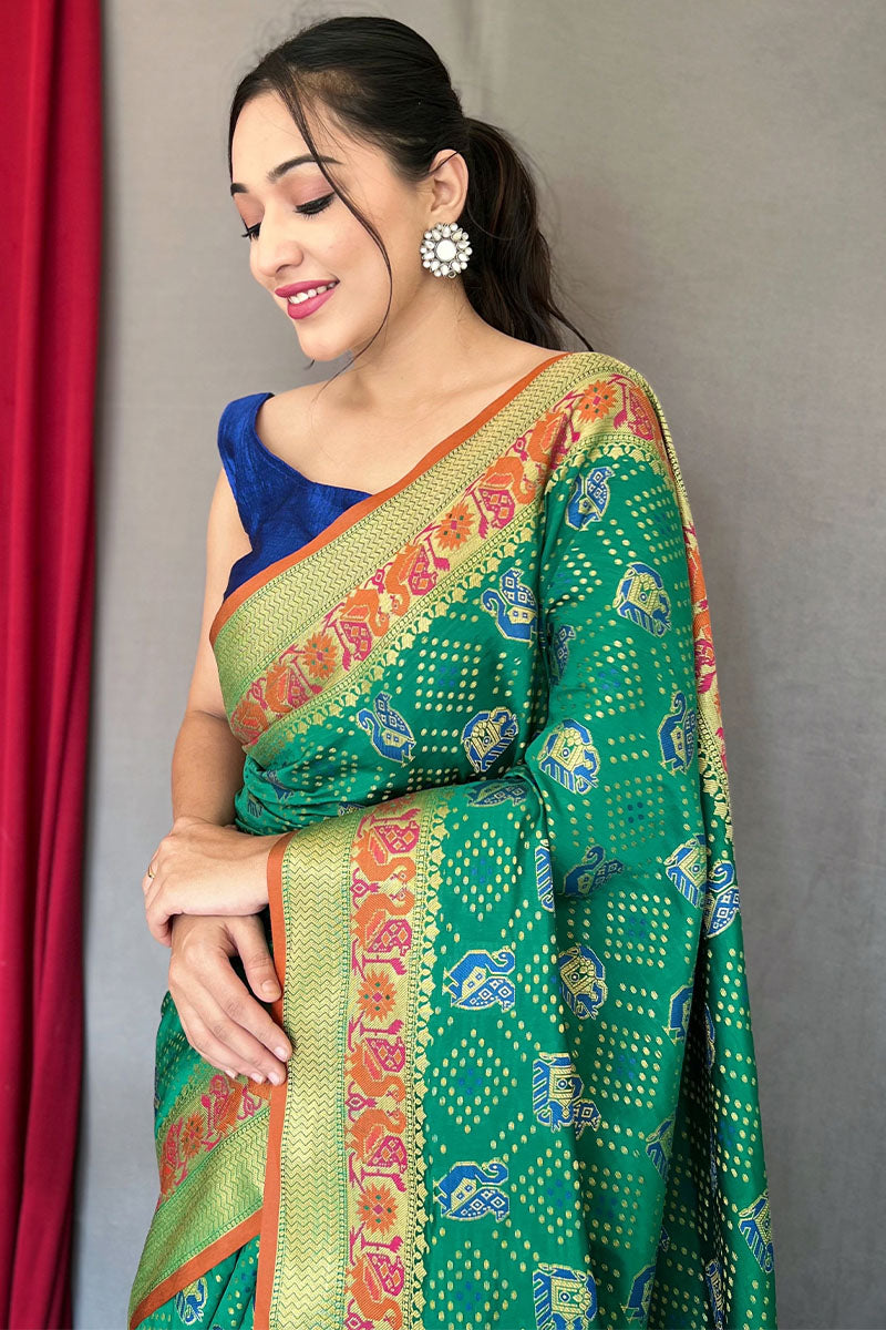 Delectable Green Patola Silk Saree with Propinquity Blouse Piece