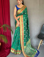 Mesmeric Green Patola Silk Saree with Twirling Blouse Piece