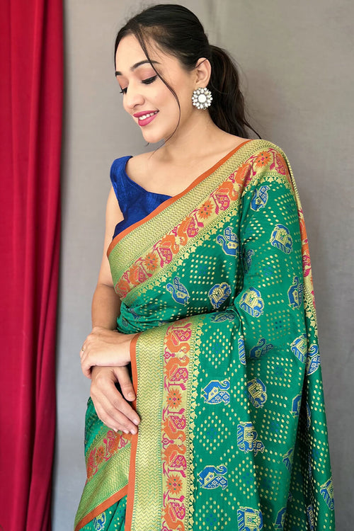 Load image into Gallery viewer, Mesmeric Green Patola Silk Saree with Twirling Blouse Piece
