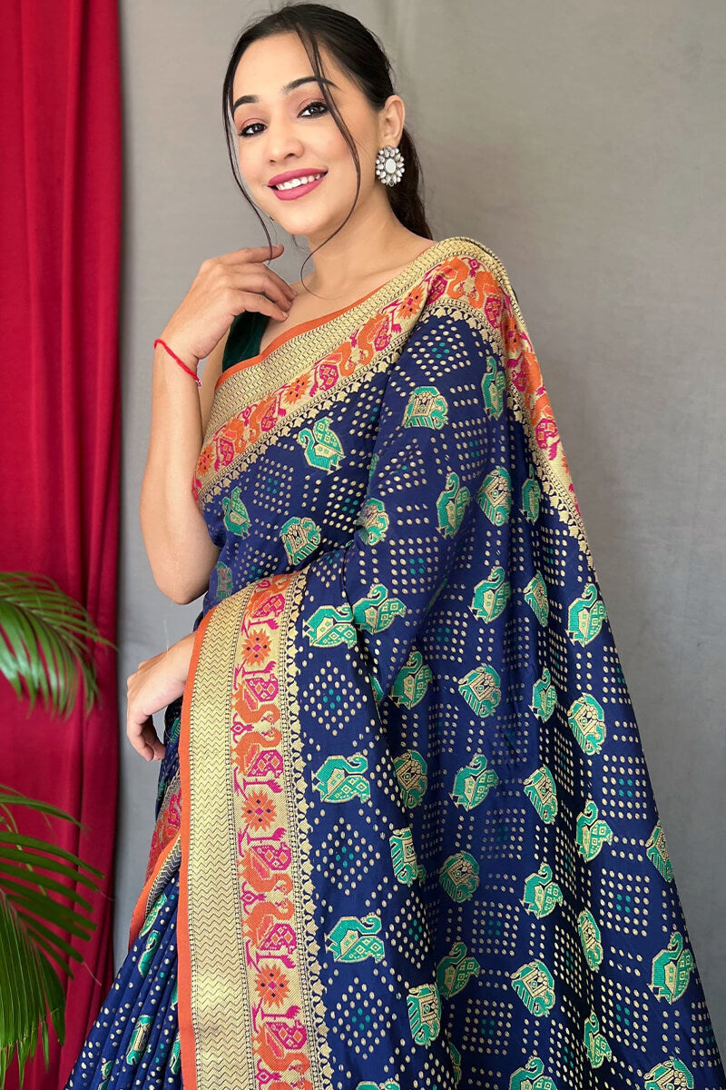 Beauteous Navy Blue Patola Silk Saree with Chatoyant Blouse Piece