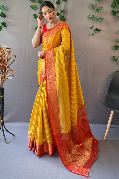 Load image into Gallery viewer, Desirable Yellow Organza Silk Saree With Effervescent Blouse Piece
