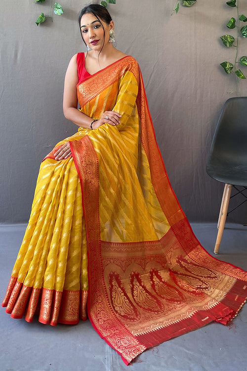 Load image into Gallery viewer, Desirable Yellow Organza Silk Saree With Effervescent Blouse Piece
