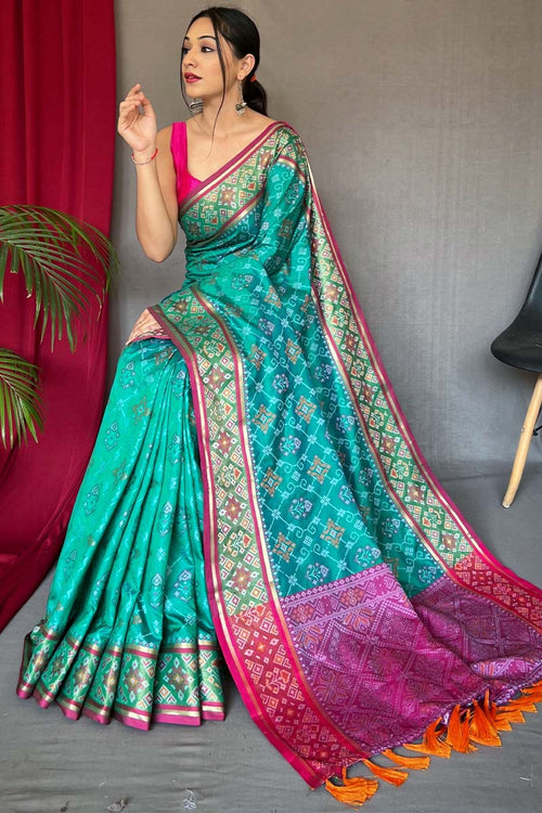 Load image into Gallery viewer, Pleasurable Turquoise Patola Silk Saree with Snappy Blouse Piece
