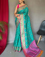 Pleasurable Turquoise Patola Silk Saree with Snappy Blouse Piece