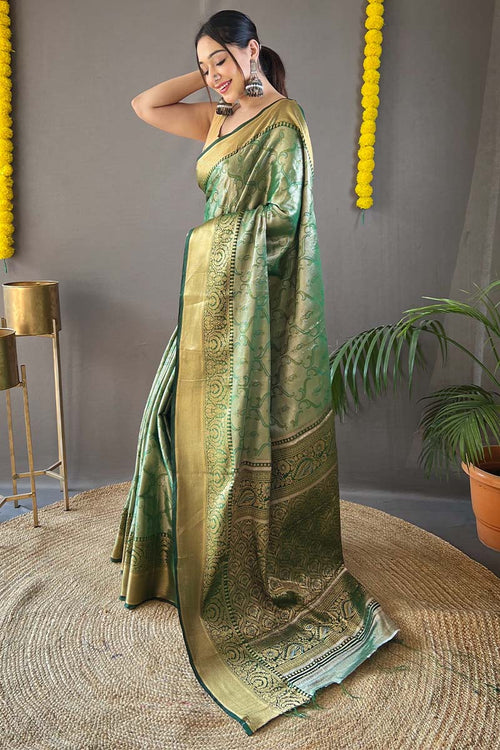 Load image into Gallery viewer, Desuetude Green Kanjivaram Silk Saree With Fugacious Blouse Piece
