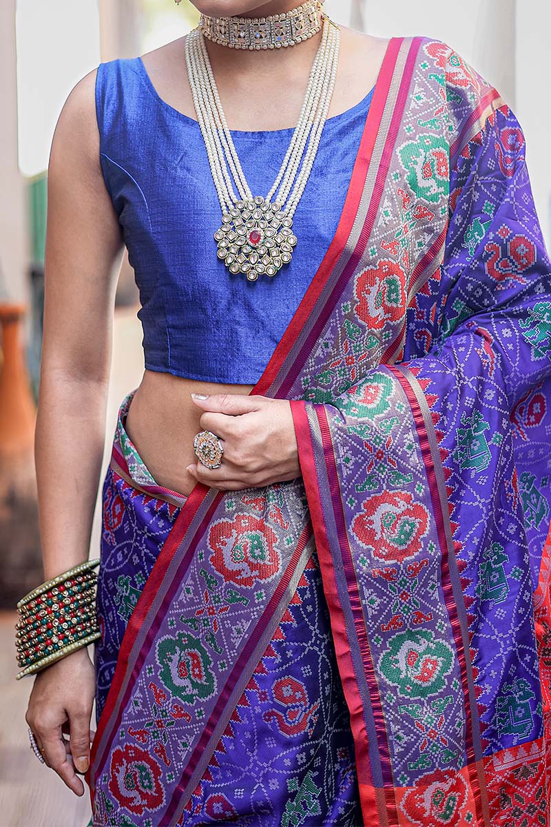 Appealing Royal Blue Patola Silk Saree with Hypnotic Blouse Piece