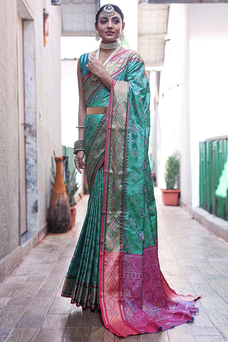 Ebullience Rama Patola Silk Saree with Fugacious Blouse Piece