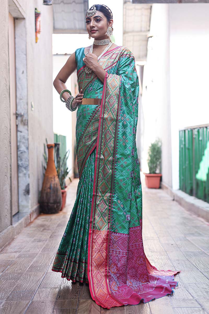 Ebullience Rama Patola Silk Saree with Fugacious Blouse Piece