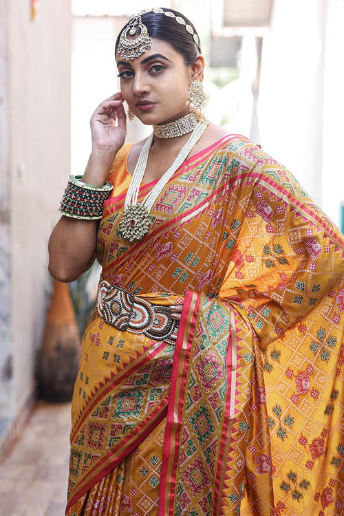 Load image into Gallery viewer, Improbable Yellow Patola Silk Saree with Incomparable Blouse Piece
