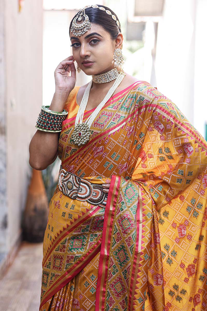 Improbable Yellow Patola Silk Saree with Incomparable Blouse Piece