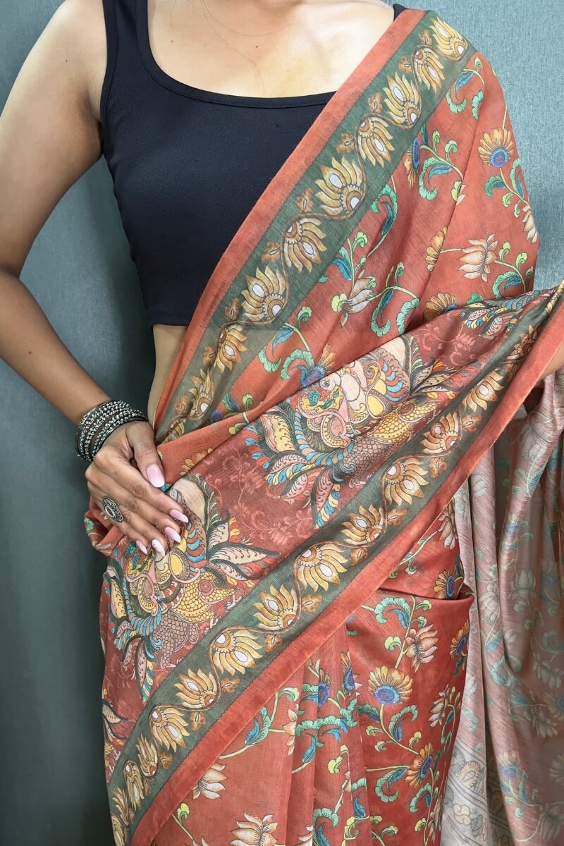 Desirable Orange Kalamkari Printed Saree With Stunner Blouse Piece