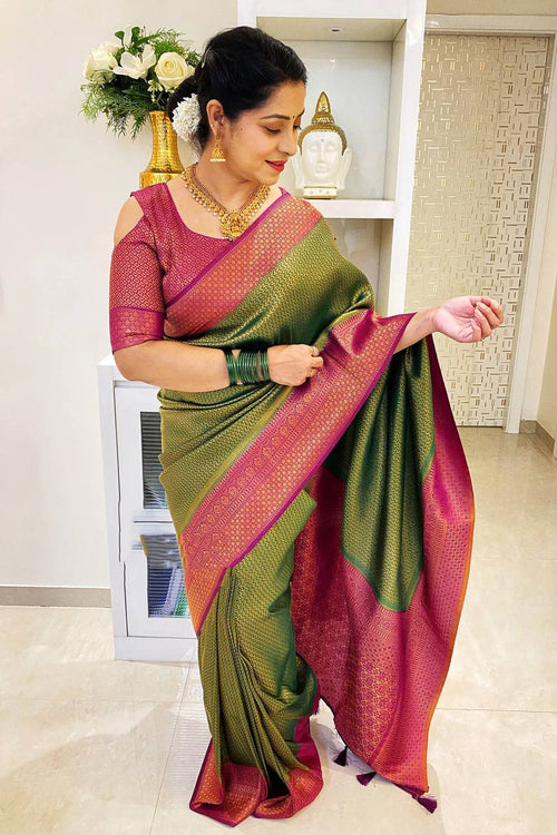 Load image into Gallery viewer, Adoring Green Soft Silk Saree With Cynosure Blouse Piece
