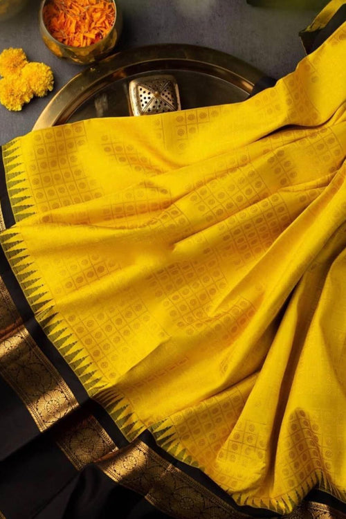 Load image into Gallery viewer, Delectable Yellow Soft Banarasi Silk Saree With Magnetic Black Blouse Piece
