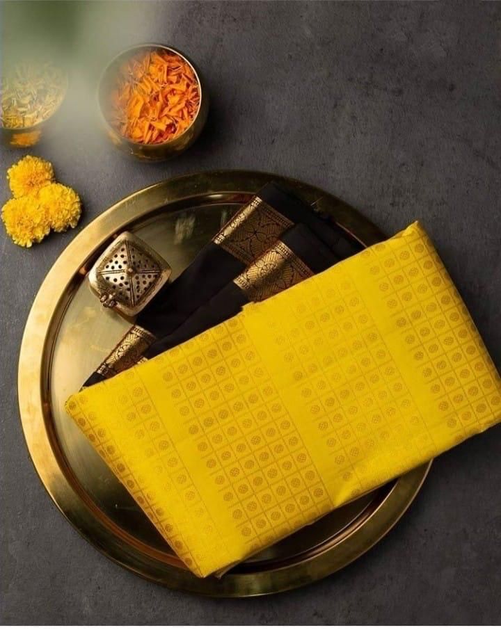 Delectable Yellow Soft Banarasi Silk Saree With Magnetic Black Blouse Piece