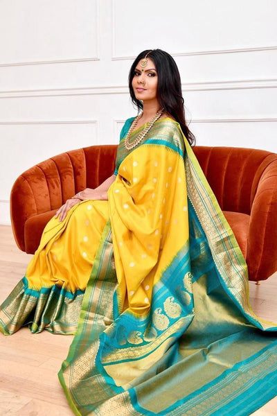 Staring Yellow Soft Banarasi Silk Saree With Charming Blouse Piece