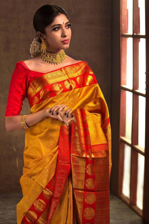 Load image into Gallery viewer, Adorning Yellow Soft Banarasi Silk Saree With Flattering Blouse Piece
