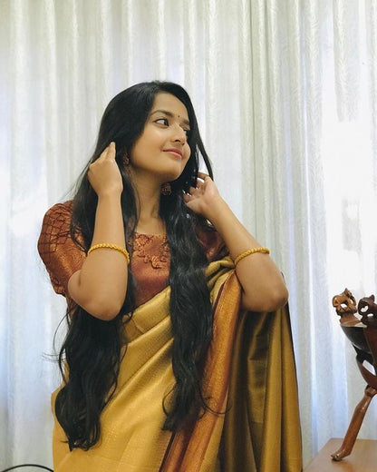 Energetic Musturd Soft Silk Saree With Alluring Blouse Piece