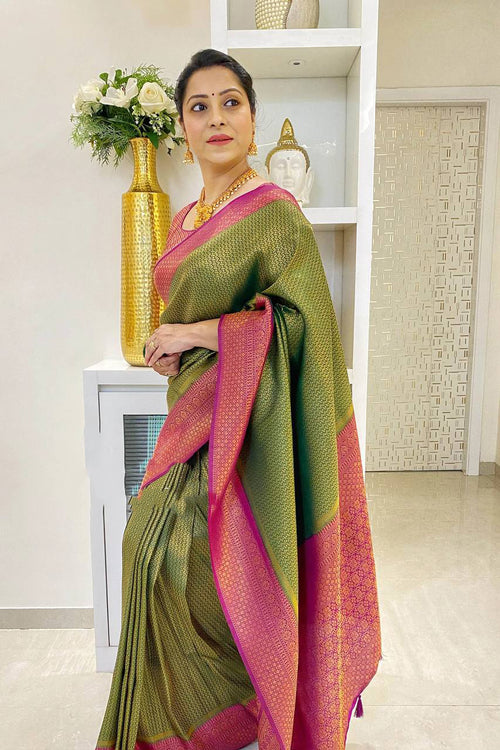 Load image into Gallery viewer, Adoring Green Soft Silk Saree With Cynosure Blouse Piece
