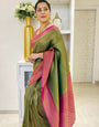 Adoring Green Soft Silk Saree With Cynosure Blouse Piece