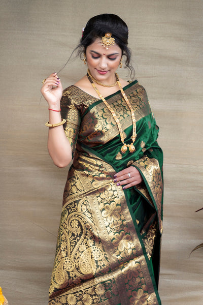 Prettiest Dark Green Banarasi Silk Saree With Assemblage Blouse Piece