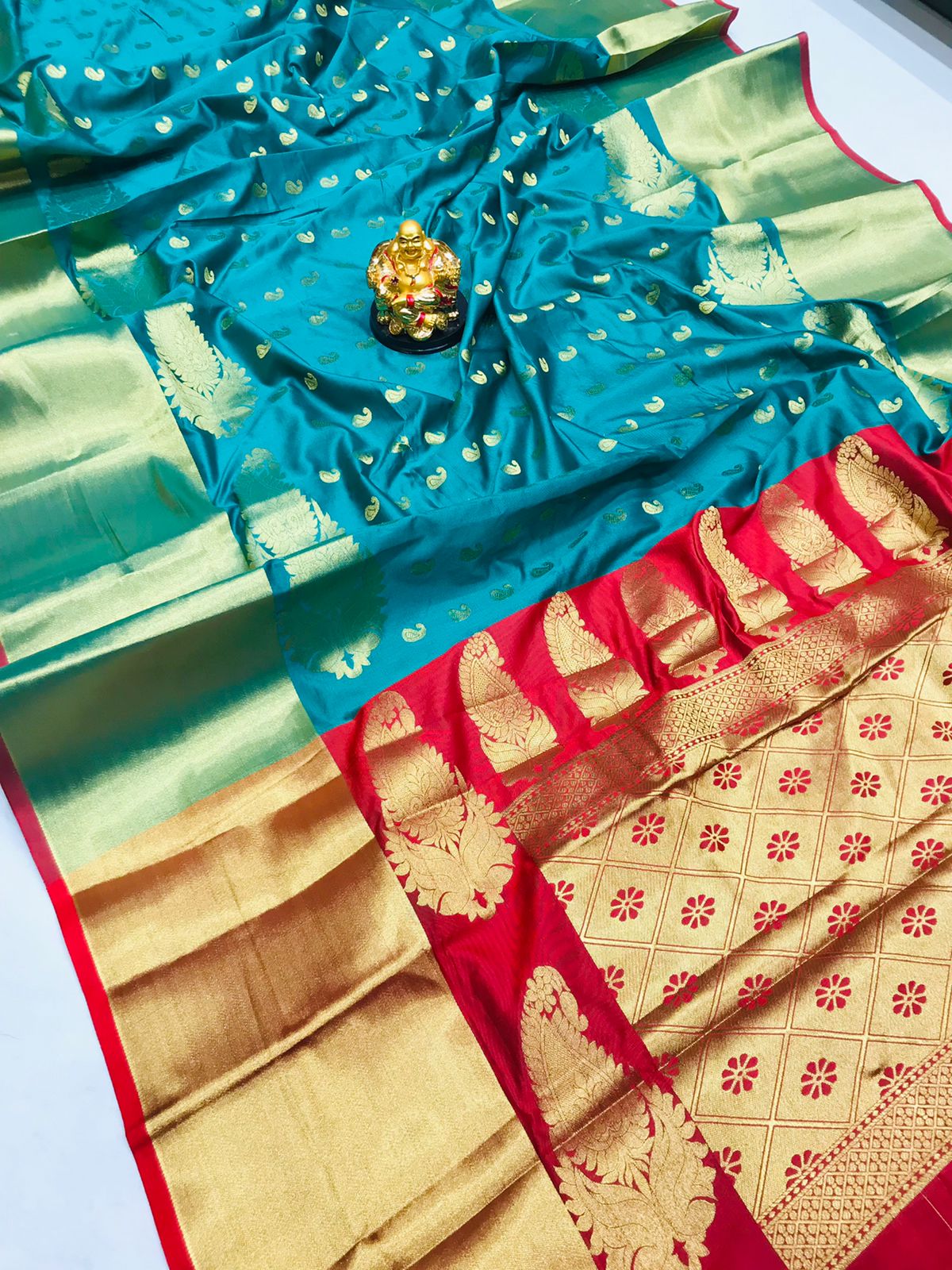 Diaphanous Firozi Banarasi Silk Saree With Flameboyant Blouse Piece