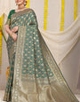 Adorning Green Soft Banarasi Silk Saree With Bewitching Blouse Piece