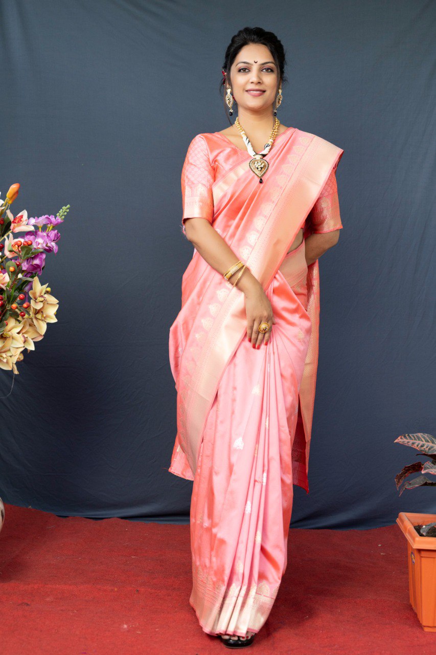 Adorning Baby Pink Banarasi Silk Saree With Classic Blouse Piece