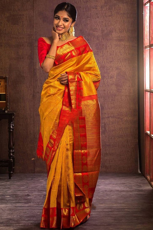 Load image into Gallery viewer, Adorning Yellow Soft Banarasi Silk Saree With Flattering Blouse Piece
