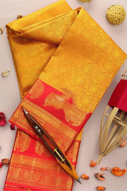 Load image into Gallery viewer, Adorning Yellow Soft Banarasi Silk Saree With Flattering Blouse Piece
