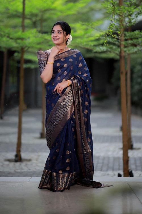 Load image into Gallery viewer, Surpassing Navy Blue Soft Banarasi Silk Saree With Glowing Blouse Piece
