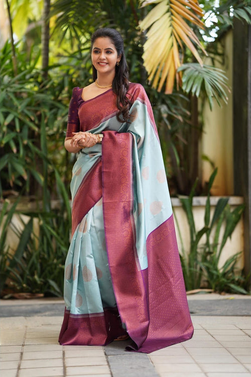 Load image into Gallery viewer, Magnetic Sky Soft Silk Saree With Felicitous Blouse Piece
