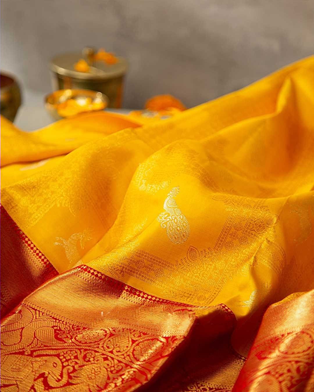 Brood Yellow Soft Banarasi Silk Saree With Cynosure Blouse Piece