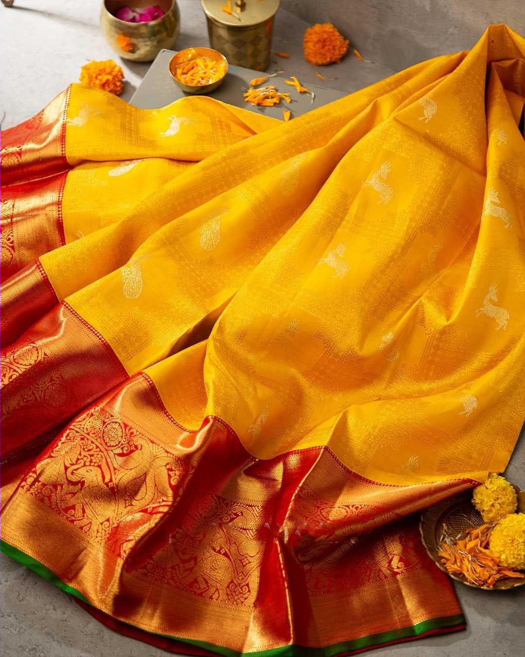 Brood Yellow Soft Banarasi Silk Saree With Cynosure Blouse Piece